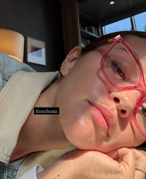 Close up of Selena Gomez wearing pink glasses