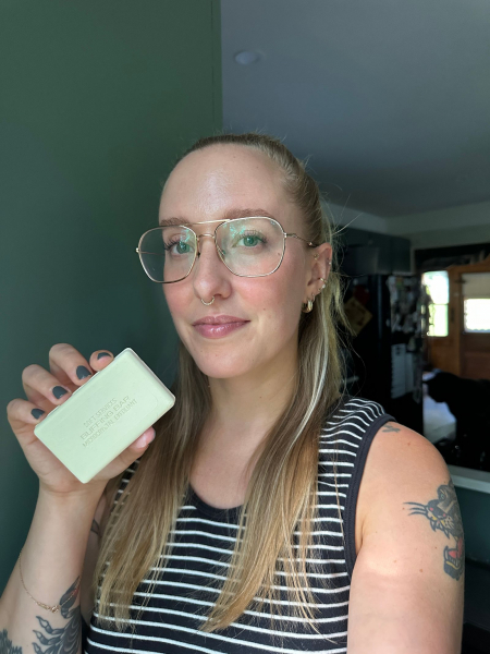 A selfie of Allure content director Kara McGrath holding the Soft Services Green Banana Buffing Bar